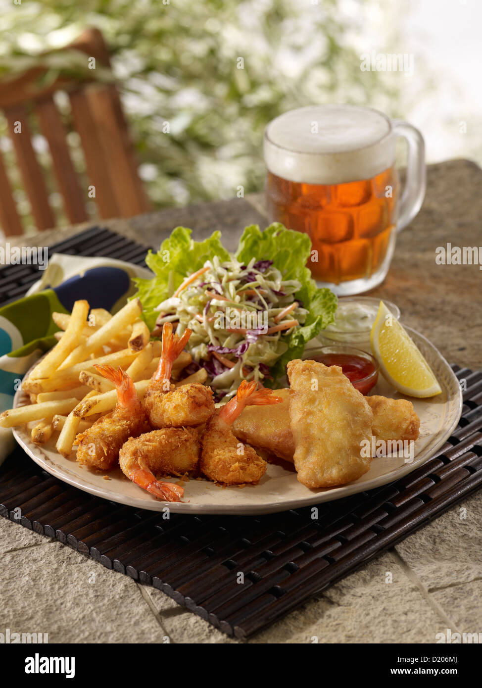 Fried shrimp and fish meal in an outdoor setting Stock Photo