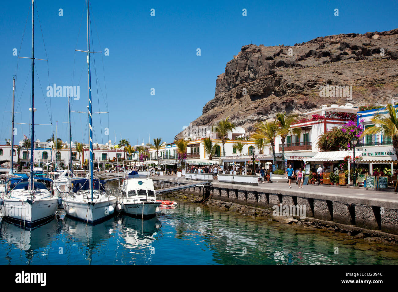 People at the promenade at harbour, Puerto de Mogan, Gran Canaria, Canary Islands, Spain, Europe Stock Photo