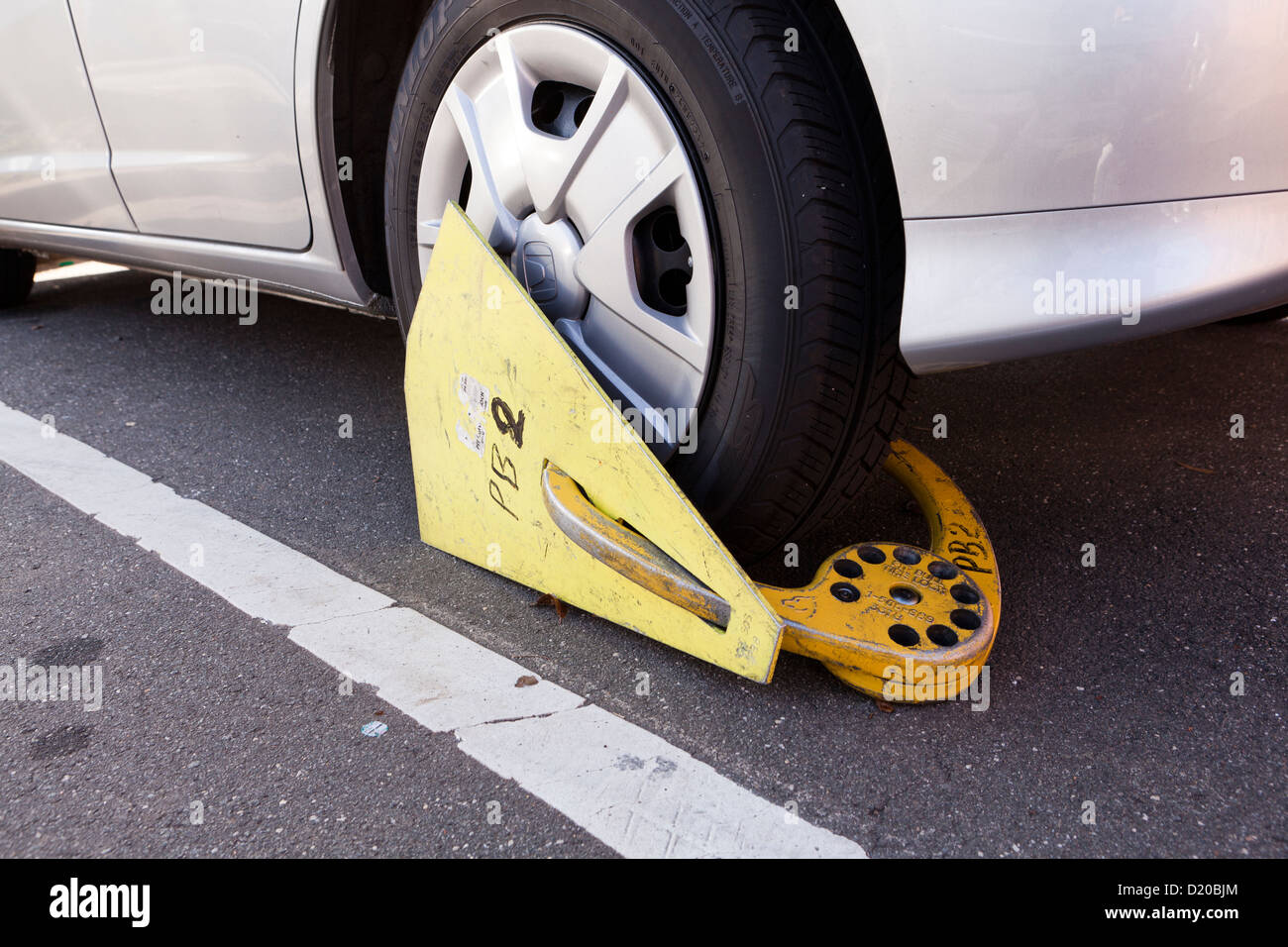 Wheel clamp used on rear wheel of car USA Stock Photo Alamy