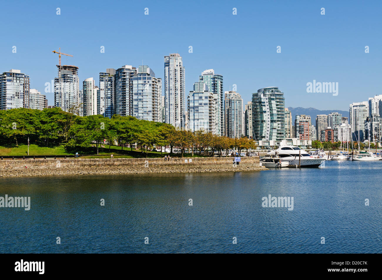 A scenic view from the south side of Vancouver's False Creek waterway looking towards Granville Island and the Yaletown area. Stock Photo