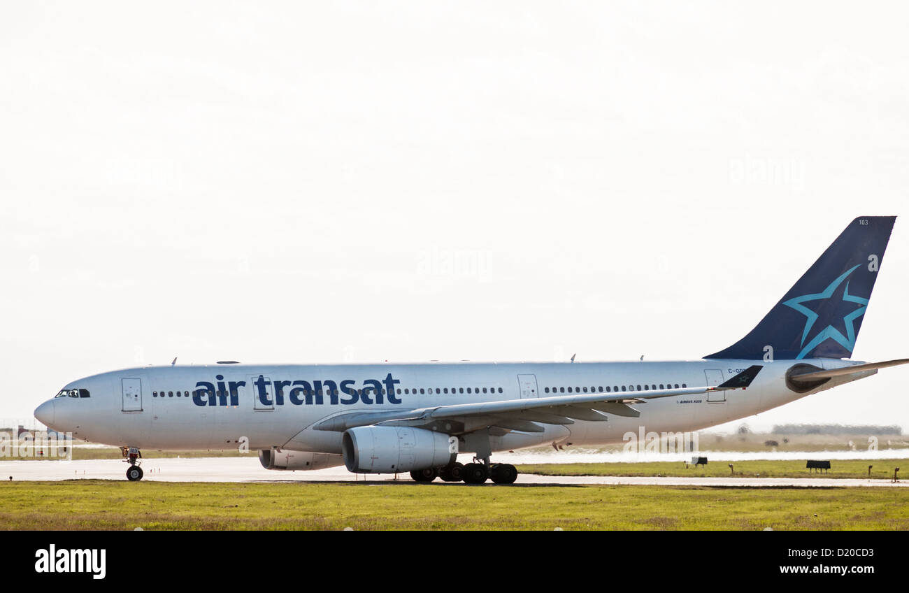 An Air Transat Airbus A330 jetliner departs from Vancouver International Airport. Stock Photo