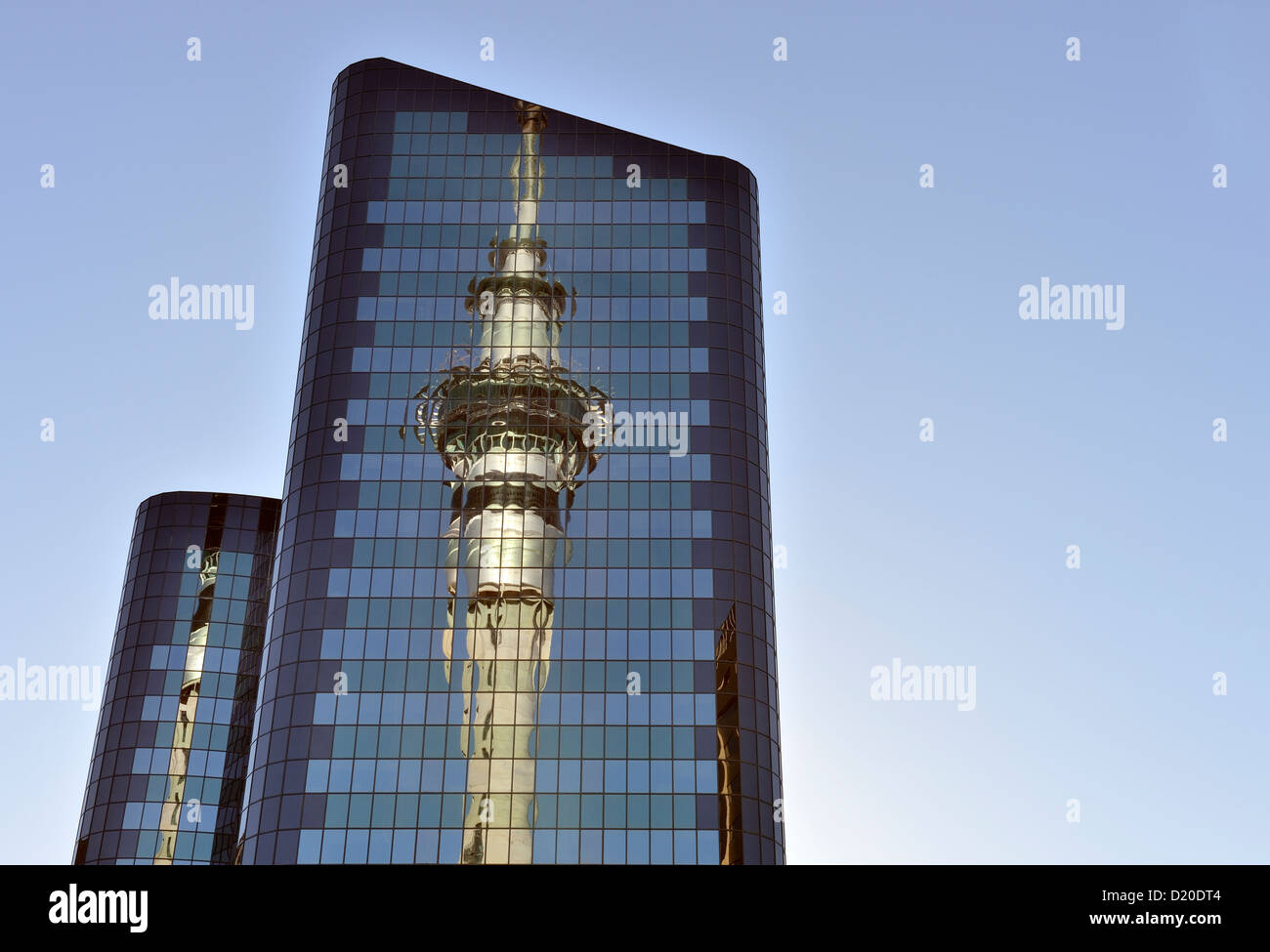 Auckland skytower reflected in adjacent glass building Stock Photo