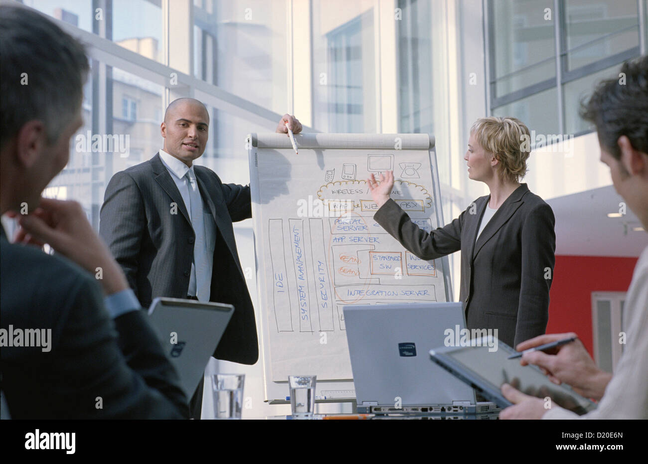Businessman at chart leading meeting in conference room License free