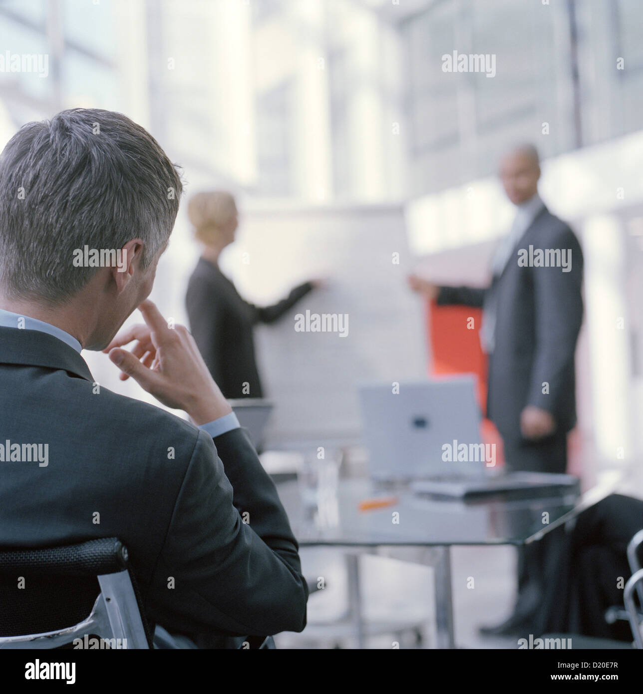 Business people at chart leading meeting in conference room License