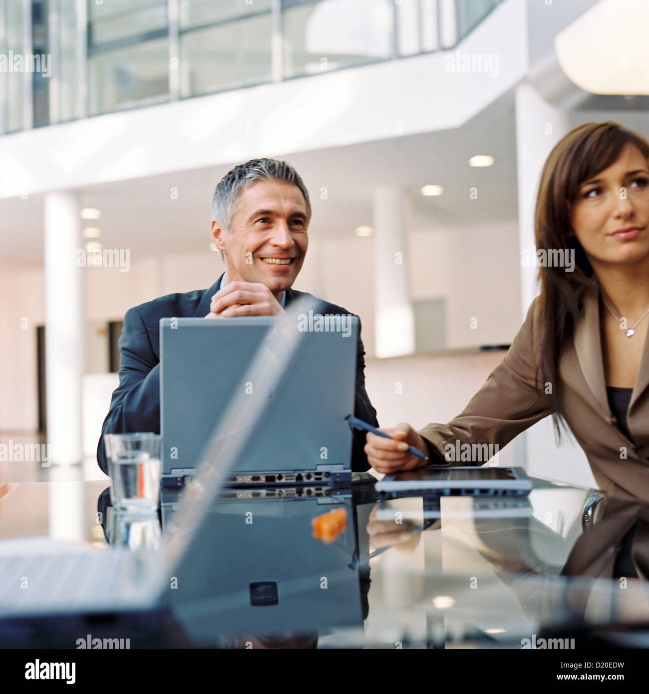 Business people with laptop in meeting License free except ads and billboards Stock Photo