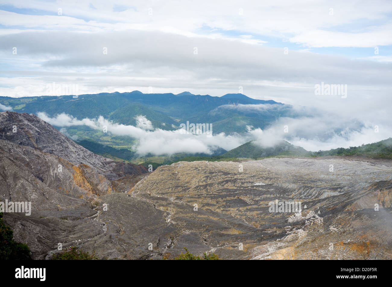 Magmatic rock of Poas volcano against lush Costa Rican rainforest Stock Photo