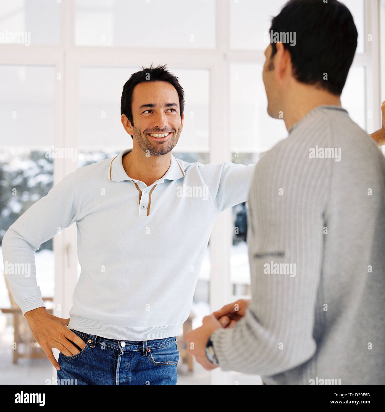Two men talking to each other License free except ads and billboards Stock Photo
