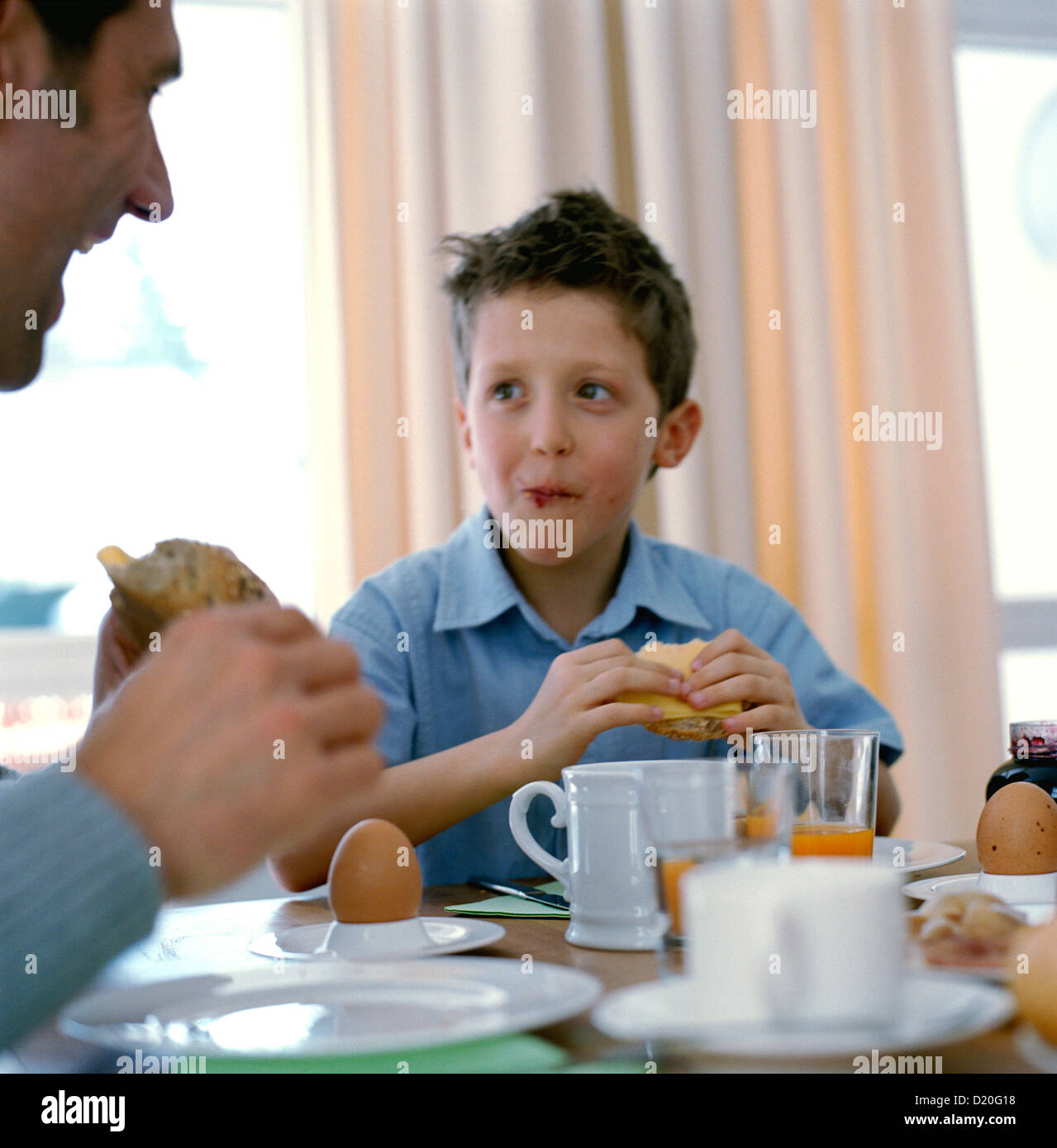 Family having breakfast together happily License free except ads and billboards Stock Photo