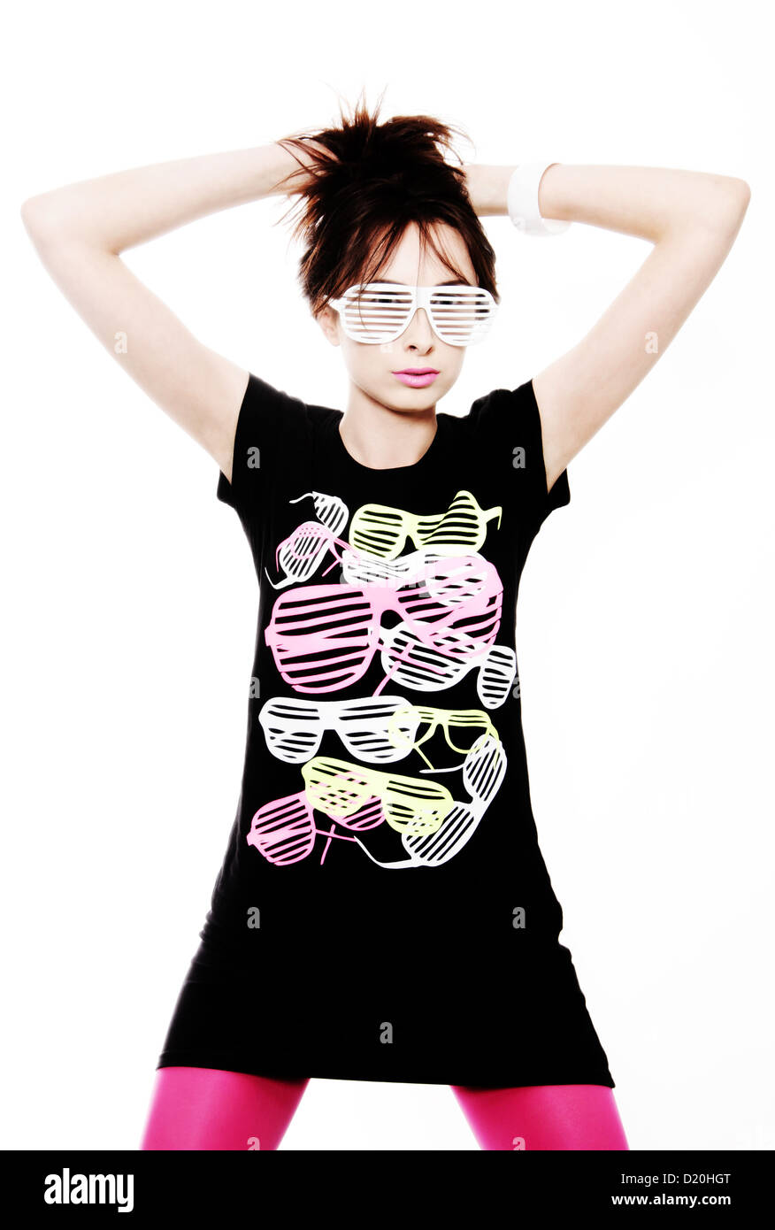 Woman, 24, posing with a cool pair of glasses and a fitting t-shirt with the same motive Stock Photo