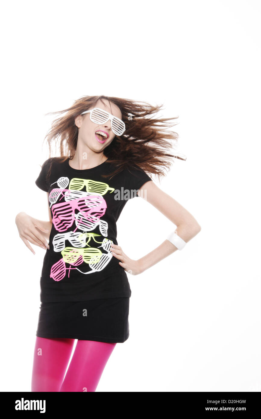 Woman, 24, posing with a cool pair of glasses and a fitting t-shirt with the same motive Stock Photo