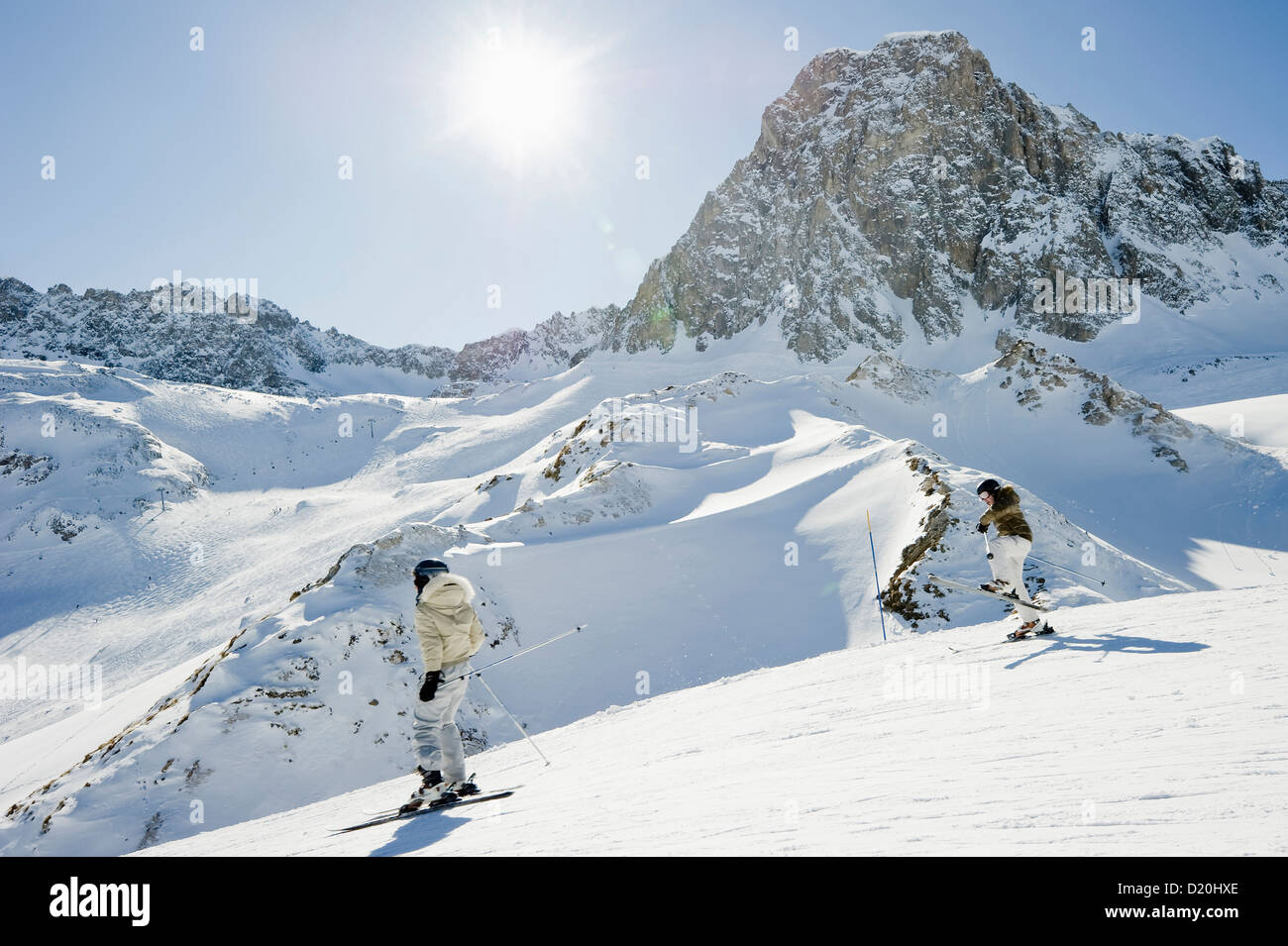 Two skiers, Snow-capped mountains, Tignes, Val d Isere, Savoie department, Rhone-Alpes, France Stock Photo