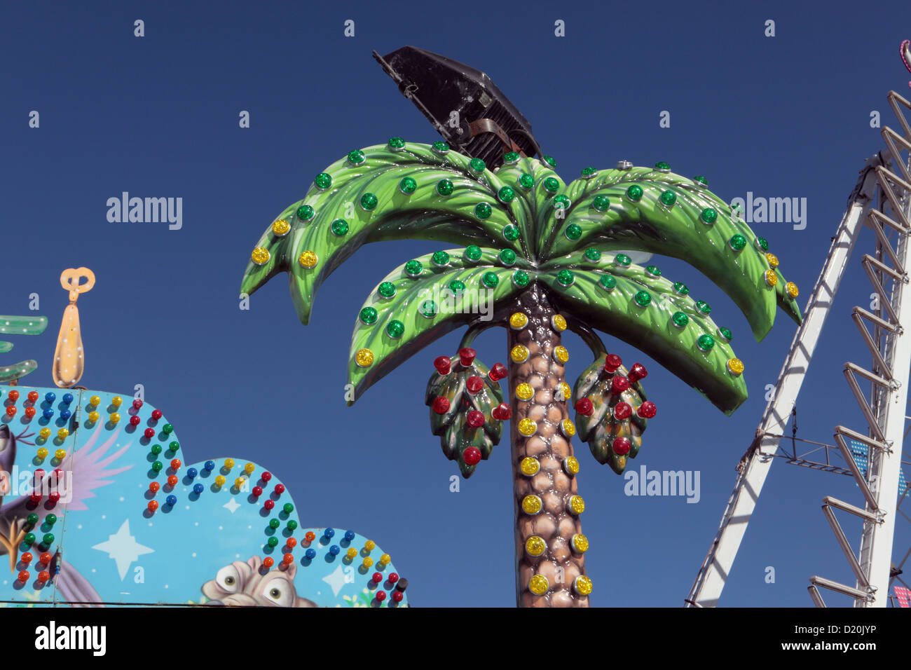 Kitsch plastic theme gaudy fake park palm tree at funfair fair ground, Puerto de la Cruz, Tenerife, Canary Islands Stock Photo