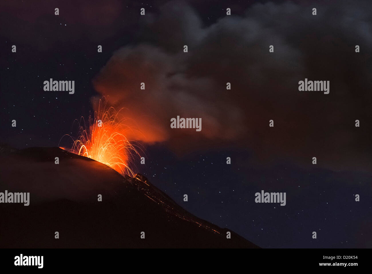 Volcano Tungurahua eruption at night, seen from Banos, Ecuador, South America Stock Photo