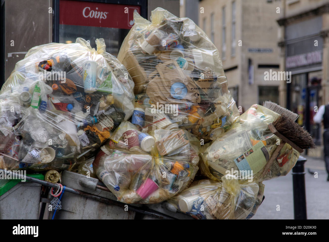 Large bags full of rubbish gathered by the refuse collector keeping the