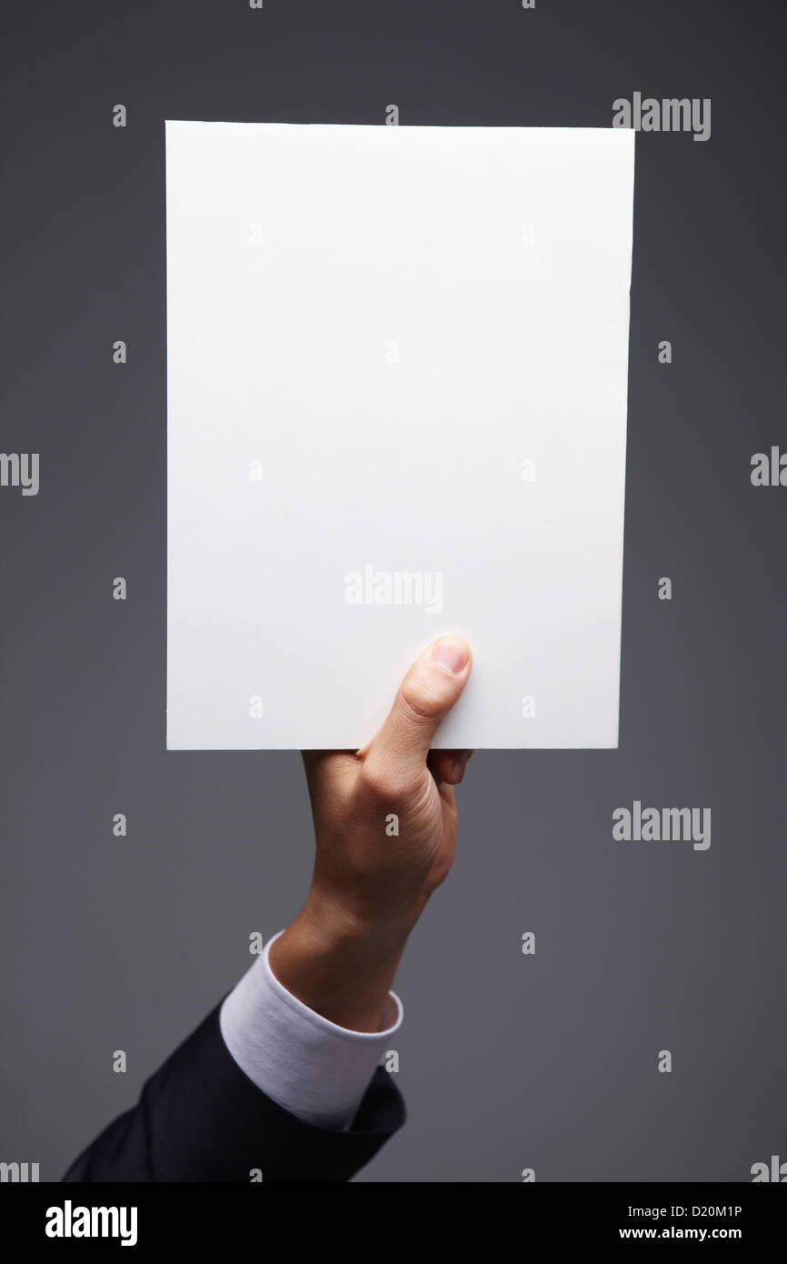 Paper Using Hand a piece of paper in hand Stock Photo - Alamy