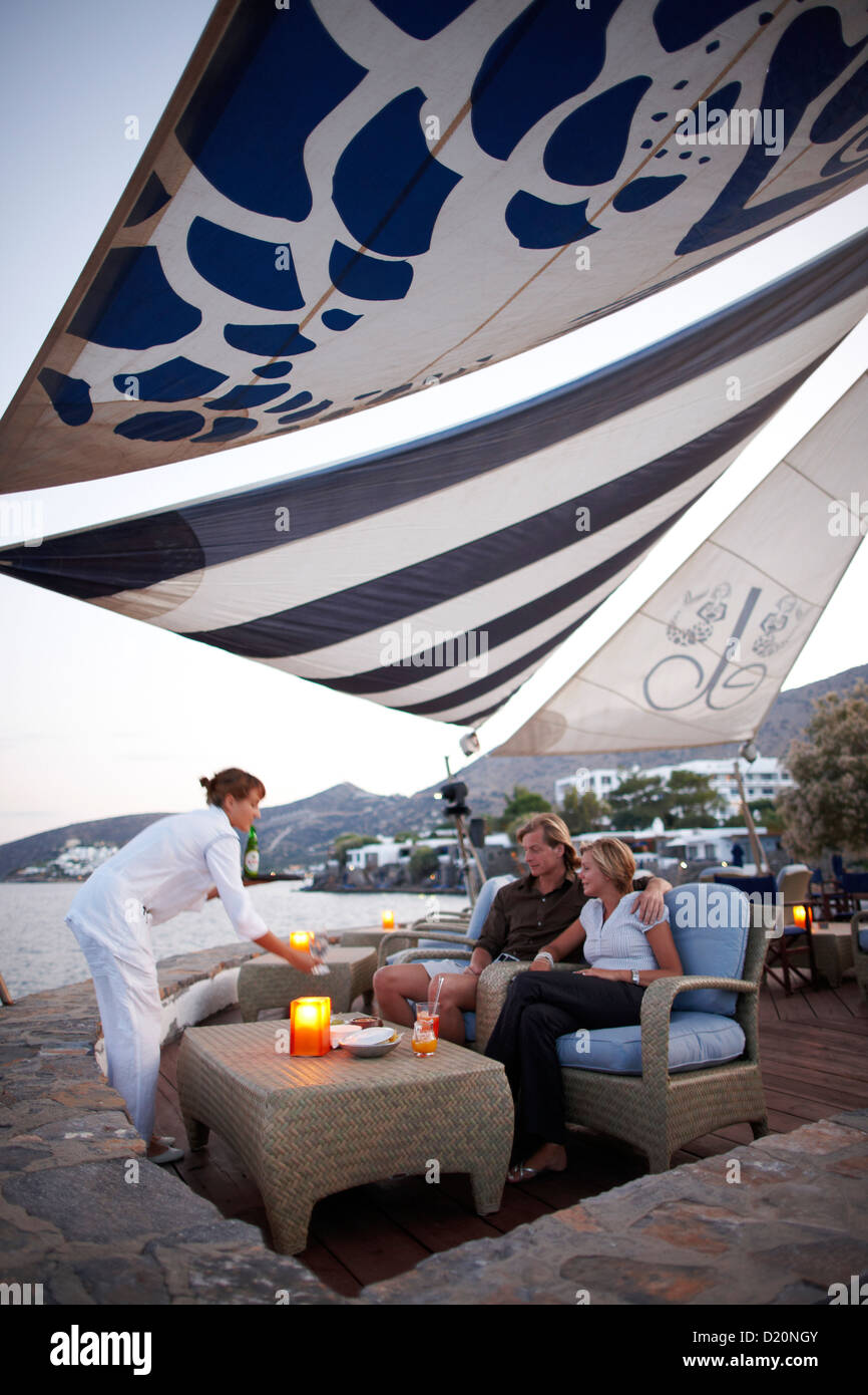 Couple at a beach bar in the evening, Elounda, Agios Nikolaos, Crete