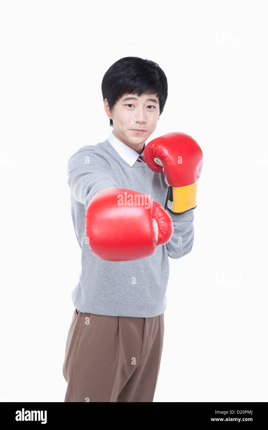 a male student punching with boxing gloves Stock Photo Alamy