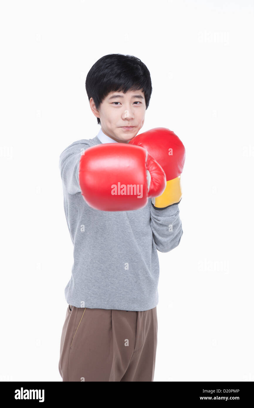 a male student punching with boxing gloves Stock Photo Alamy
