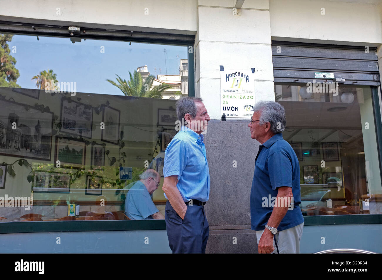 Two men talking in Valencia, Spain Stock Photo