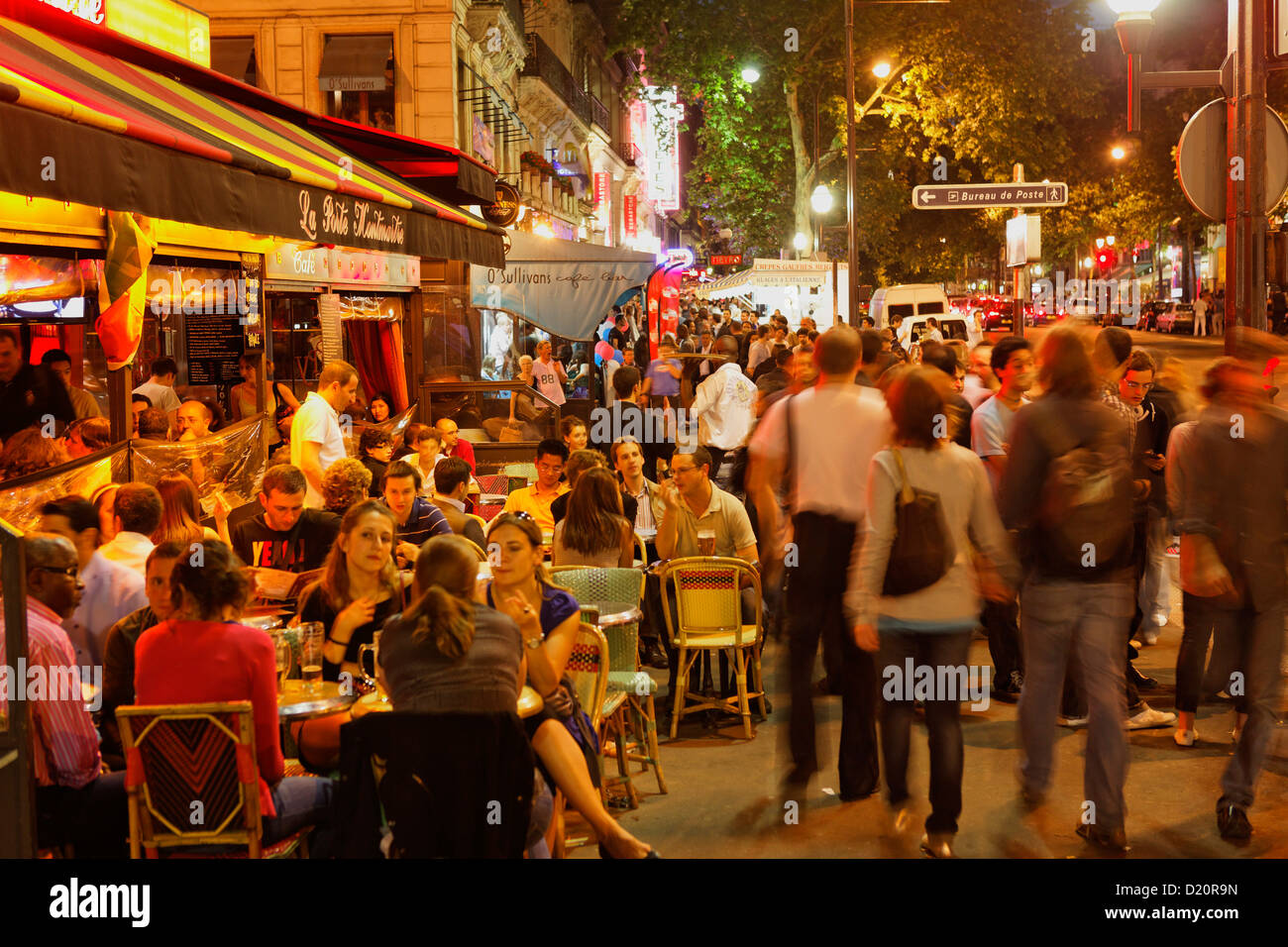 People in the street and in restaurants in the evening, La Porte Montmartre, Boulevard Montmartre, Paris, France, Europe Stock Photo