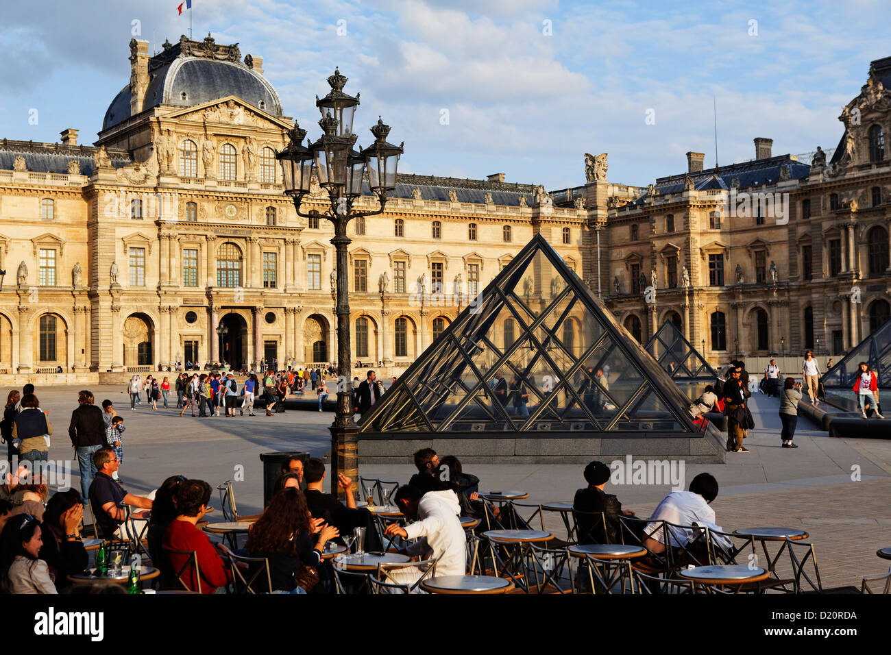 Louvre and the pyramid by I.M. Pei under clouded sky, Paris, France, Europe Stock Photo