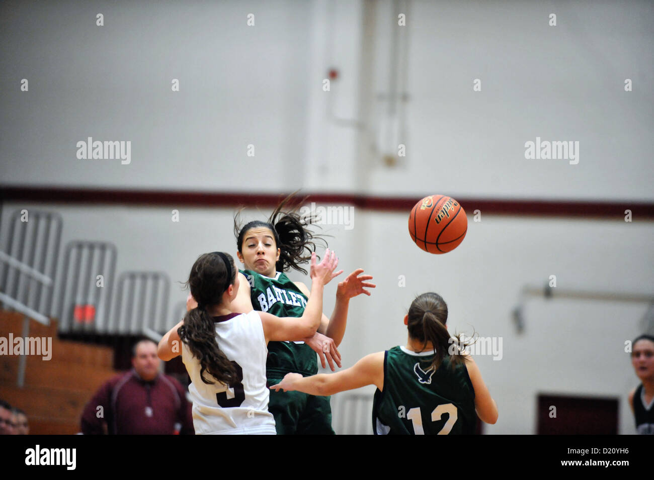 Sport Basketball Female Player Defenders double team a guard trying to bring the ball across center court. USA. Stock Photo