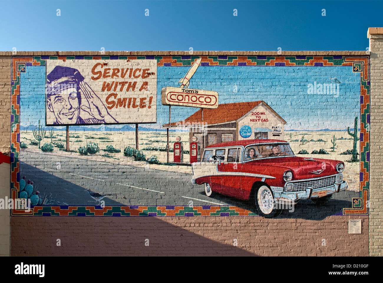 1956 Chevrolet Bel Air Station Wagon and historic gas station in mural in Clovis in Great Plains area of New Mexico, USA Stock Photo