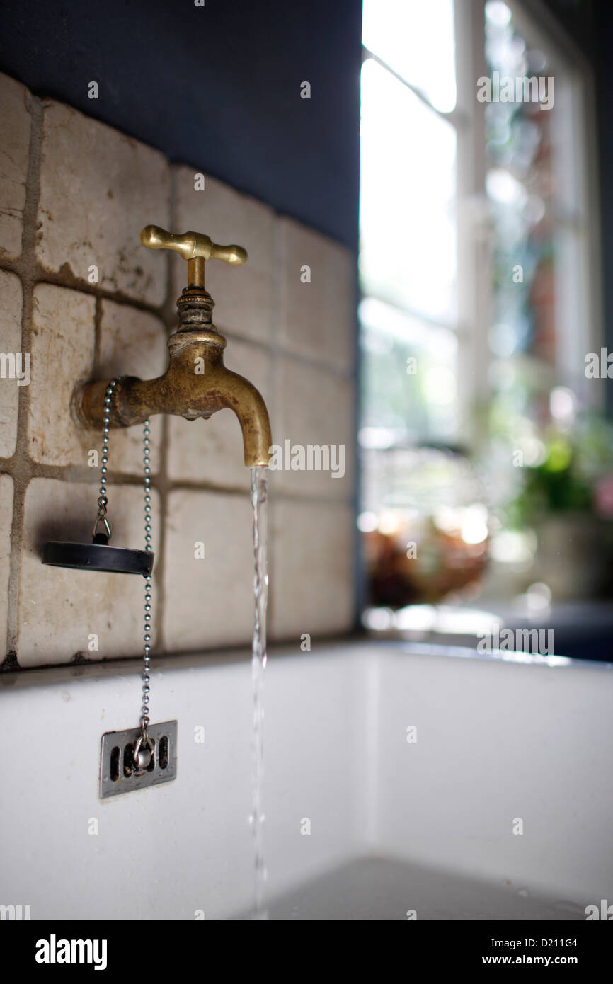 Water tap over a sink, Klein Thurow, Roggendorf, Mecklenburg-Western Pomerania, Germany Stock Photo