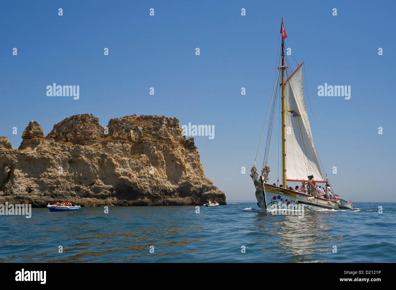 Sailing boat in front of bizar rock formations, Ponta da Piedade, near Lagos, Western Algarve, Portugal, Europe Stock Photo