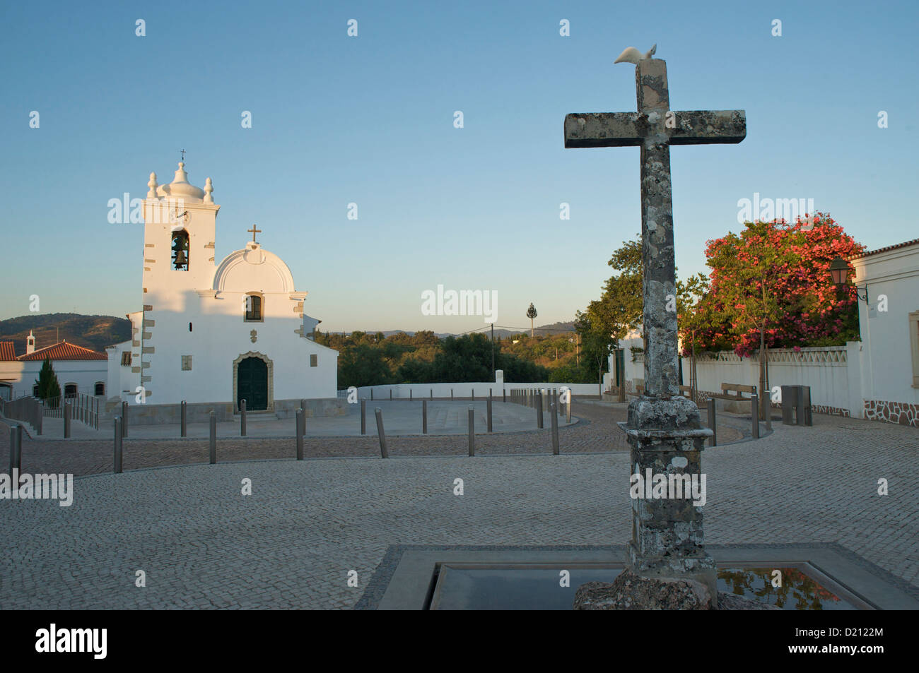 Stone cross and church at the countryside village, Querenca, Algarve, Portugal, Europe Stock Photo
