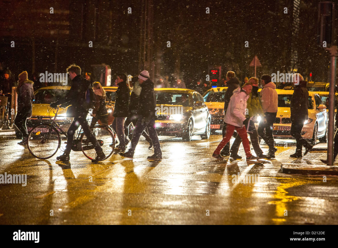 Bike, cycle traffic in the city, at night, snowfall, bike path. Copenhagen, Denmark, Europe. Stock Photo