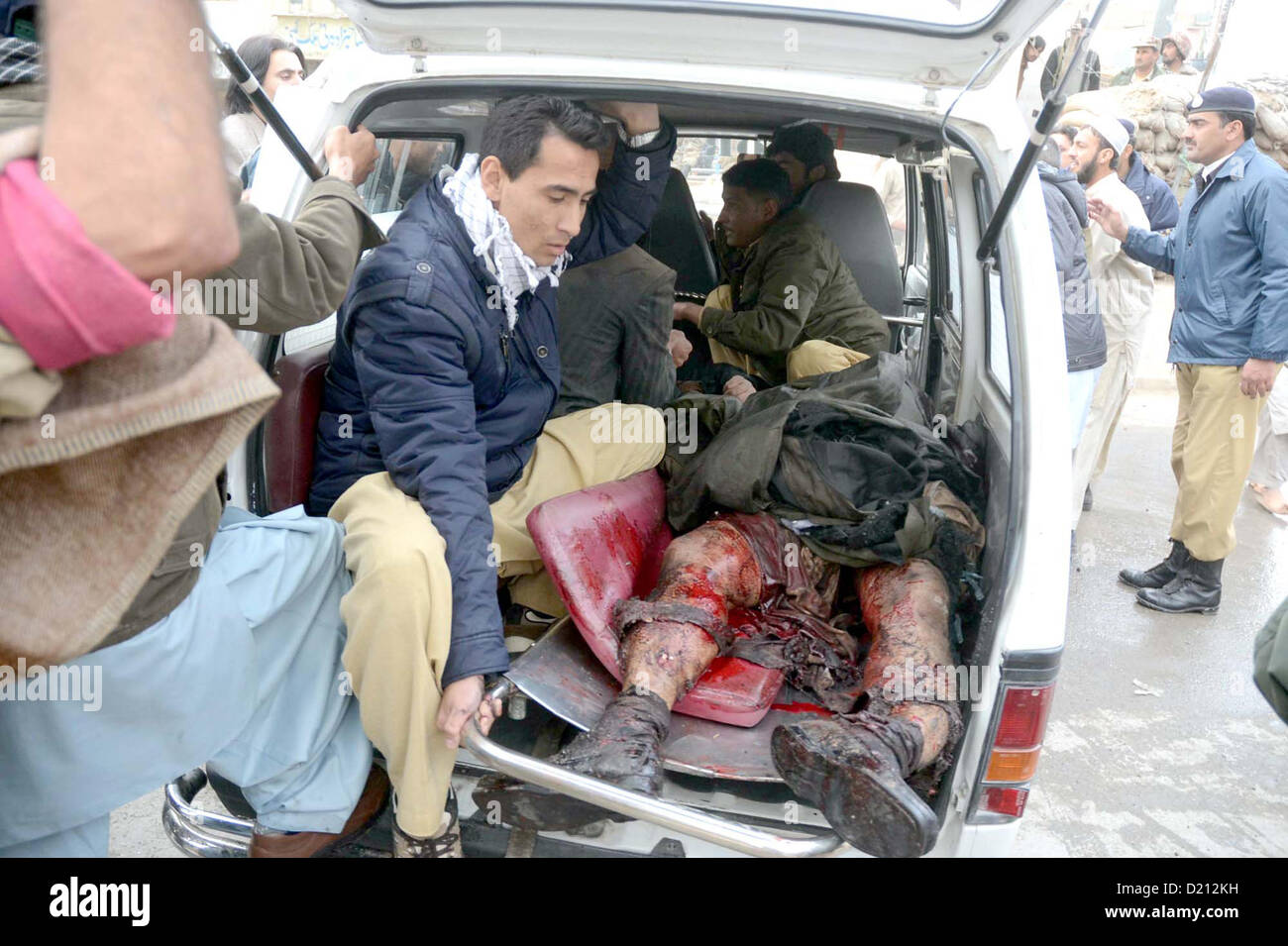 Injured of bomb blast is being shifted to hospital after blast, at Bacha Khan Chowk in Quetta on Thursday, January 10, 2013. At least eleven people were killed and more than 50 including three FC personnel were injured in a powerful blast Bacha Khan square area. The bomb was planted in a car parked at Bacha Khan square on Iqbal-Avenue, which ripped through during busy hours in shopping area of the city. Stock Photo