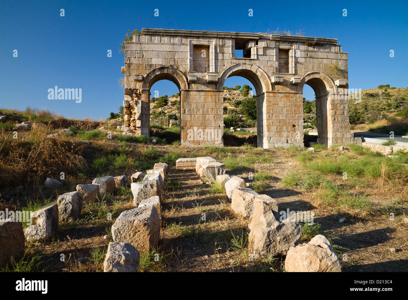 Triple arched gateway of ancient Patara, Triumphal arch of Metius Modestus, lycian coast, Mediterranean Sea, Turkey Stock Photo