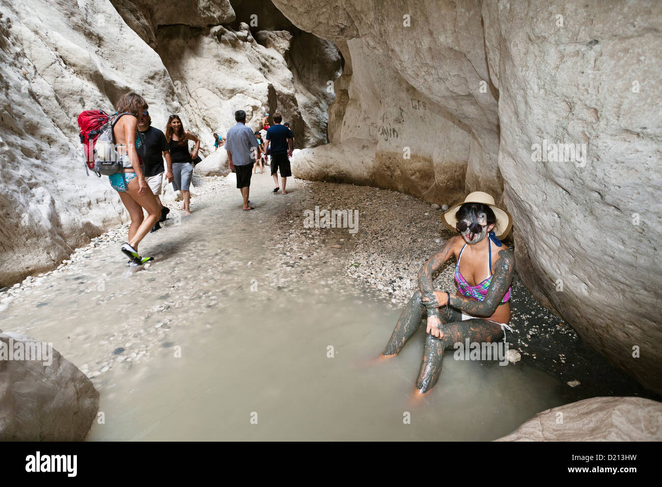 Woman having a mud bath in the Saklikent gorge near Tlos and Fethiye, lycian coast ...