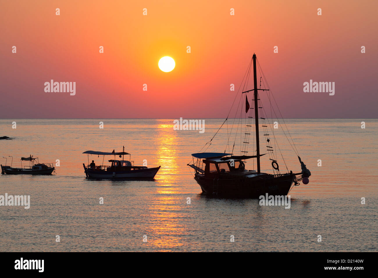 Sailing boats at sunrise on the sea, Cirali, Mediterranean Sea, Lycia, Turkey Stock Photo