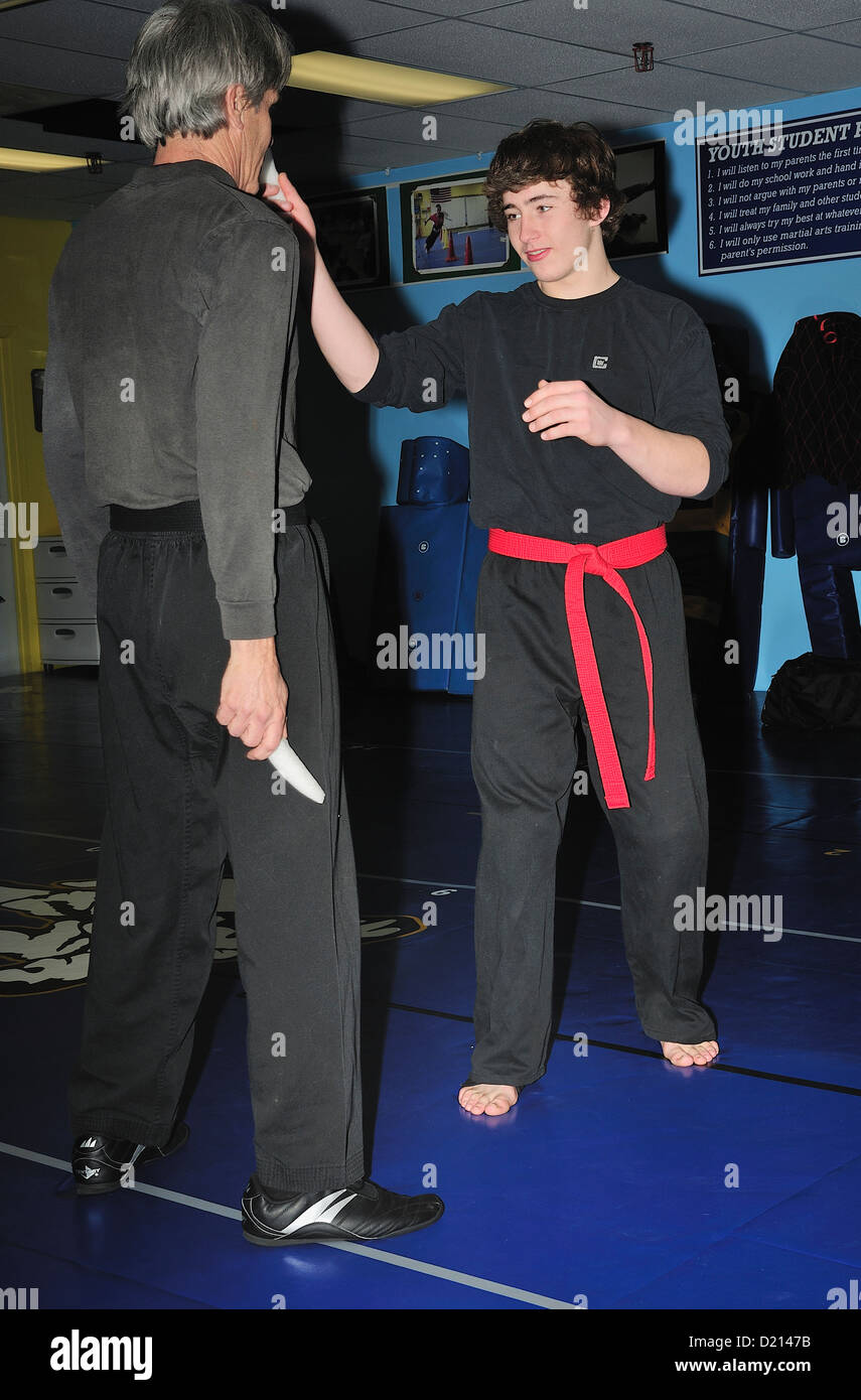Hapkido Black Belt and Red Belt combatants practicing their art at a