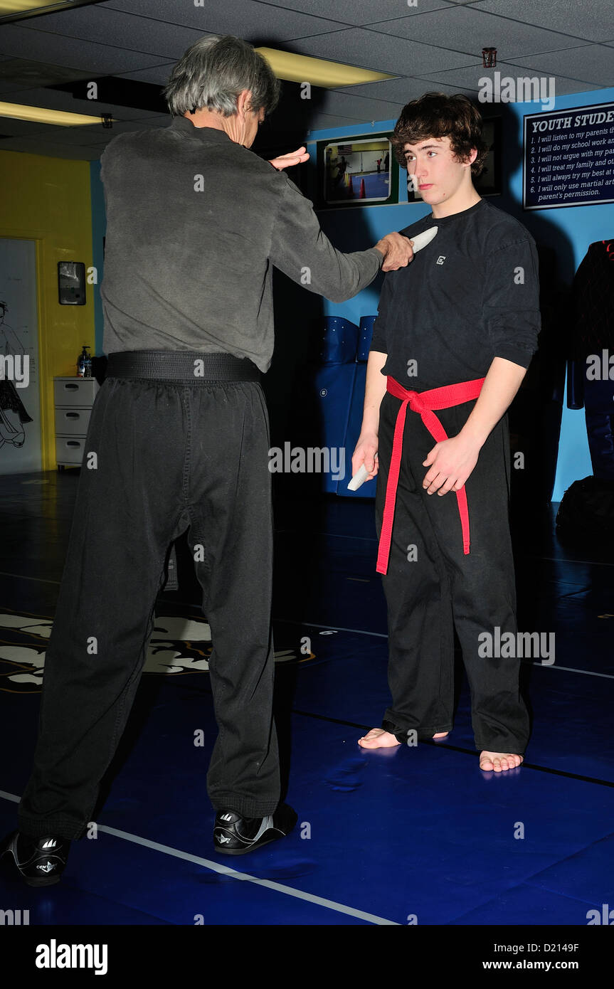 Hapkido Black Belt and Red Belt combatants practicing their art at a