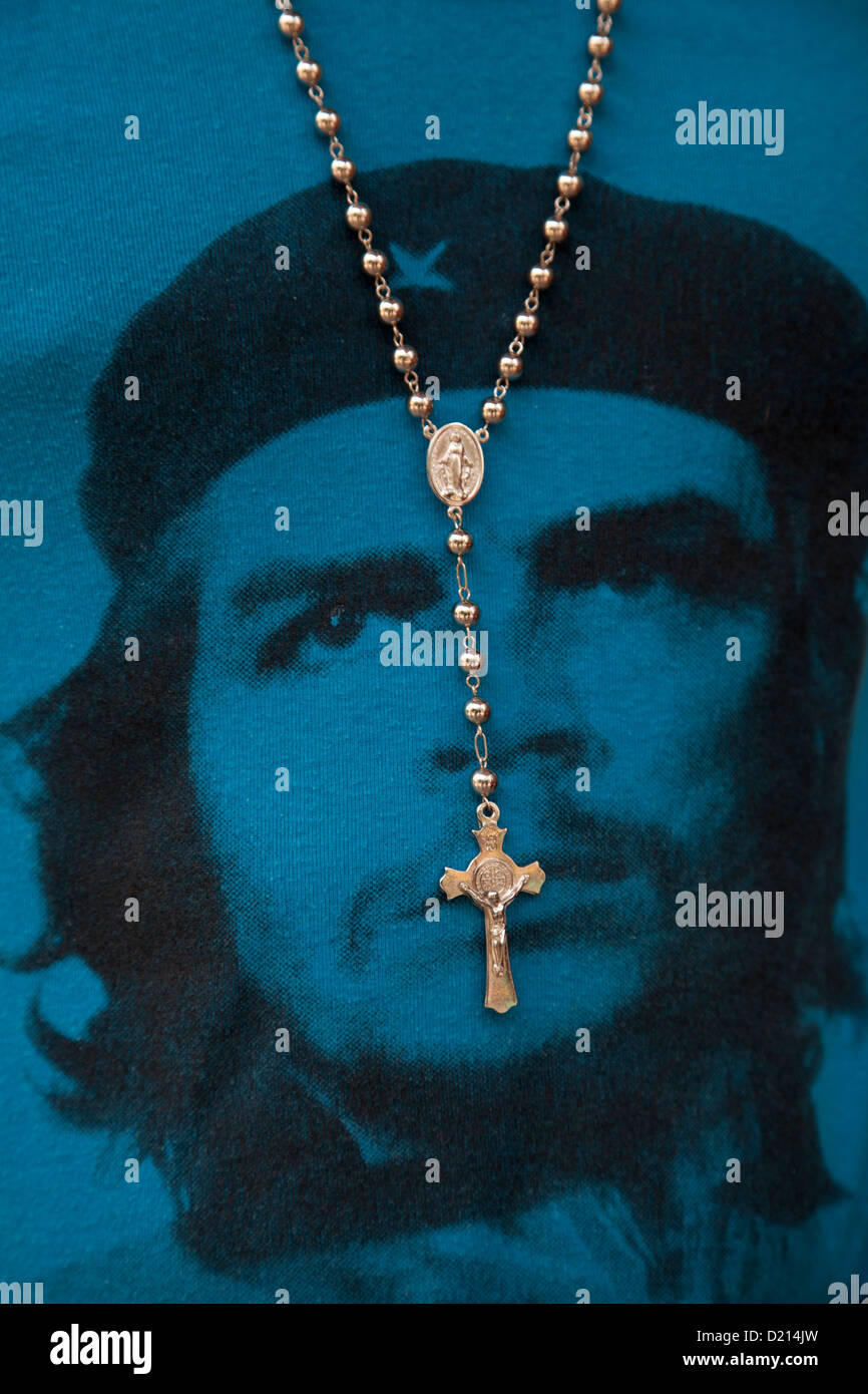 Cross hanging from the neck of man wearing a blue Che Guevara T-shirt, Havana, Havana, Cuba, Caribbean Stock Photo