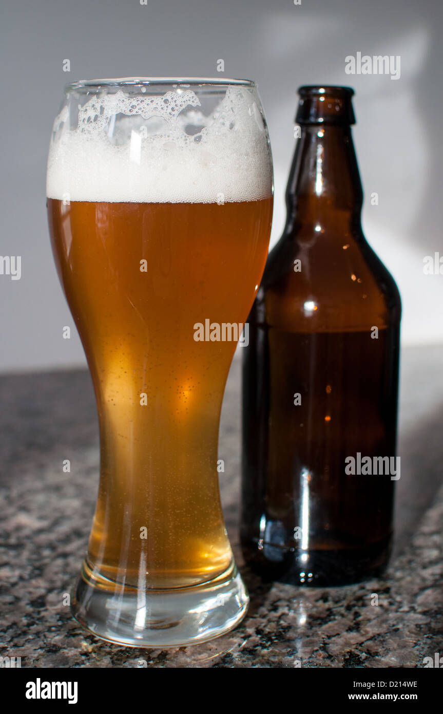 Wheat beer glass and brown bottle Stock Photo Alamy