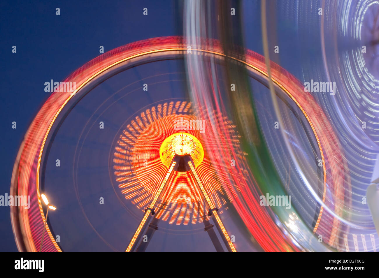 Ferris wheel and another ride at Munich Oktoberfest in Germany Stock ...