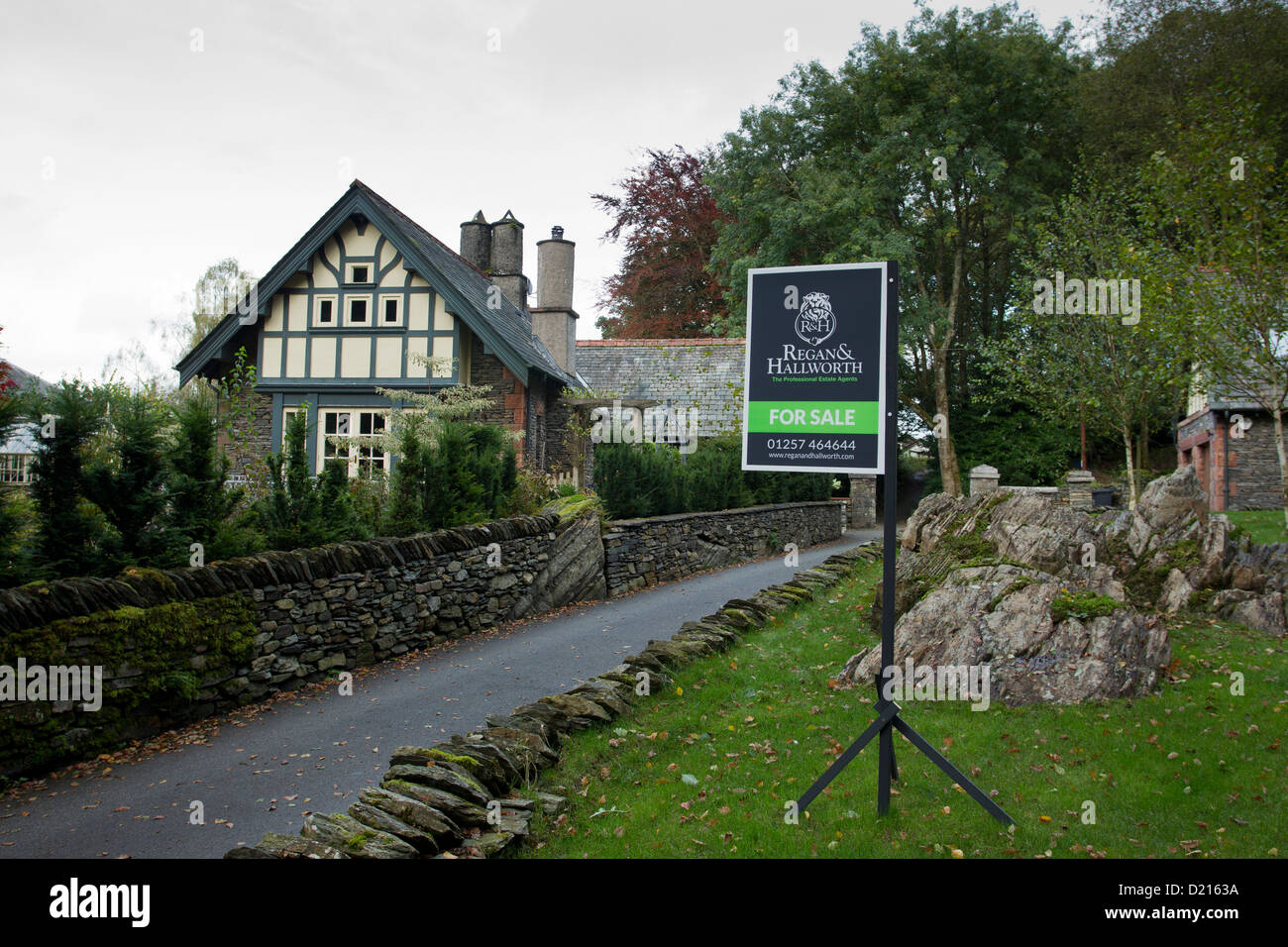 Regan & Hallwoth estate agents agent for sale sign outside detached