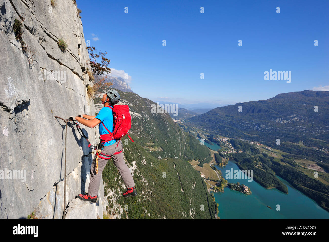 Young man climbing fixed rope route Rino Pisetta, Lago die Toblino, Sarche, Calavino, Trentino, Trentino-Alto Adige, Suedtirol, Stock Photo