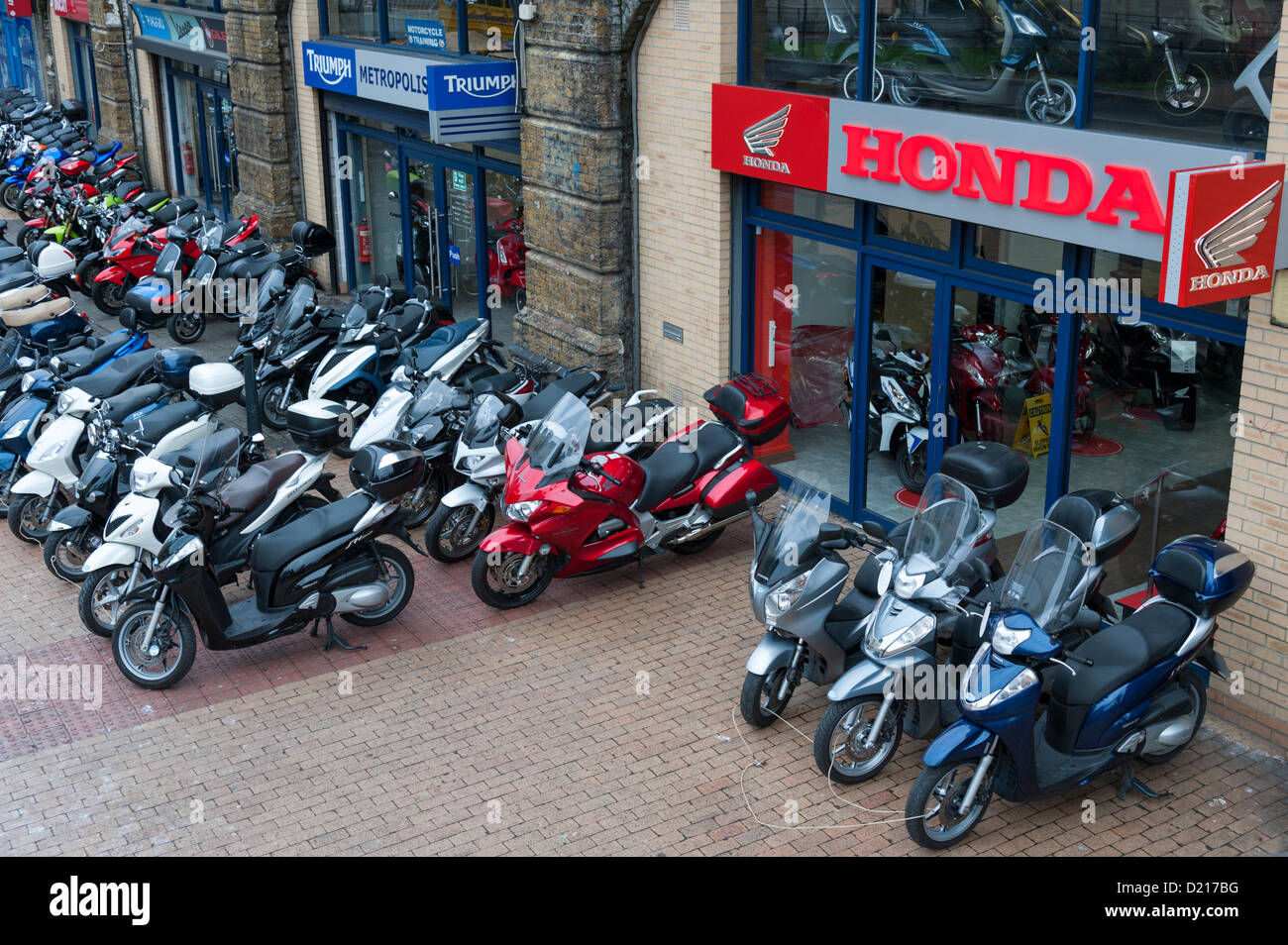 Honda motorcycle dealer shop at Vauxhall London UK with motor bikes parked outside for sale and