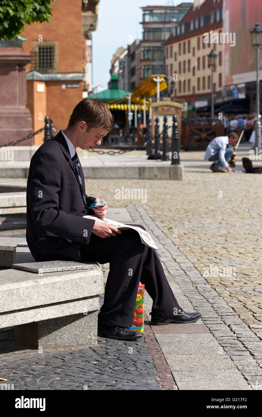 Wroclaw, Poland, a young employee makes lunch in the market square Stock Photo