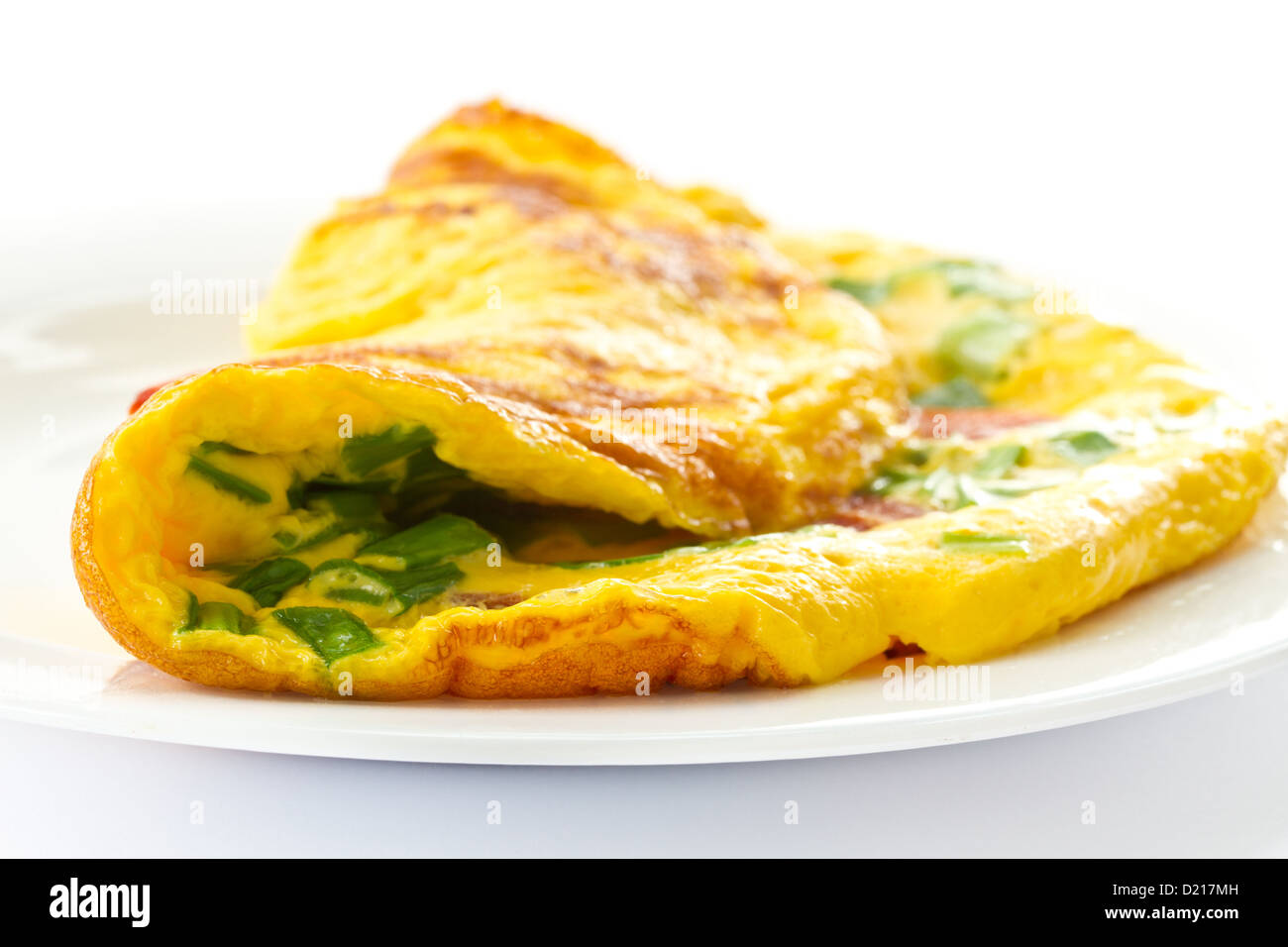 scrambled eggs with fresh herbs on a white background Stock Photo - Alamy