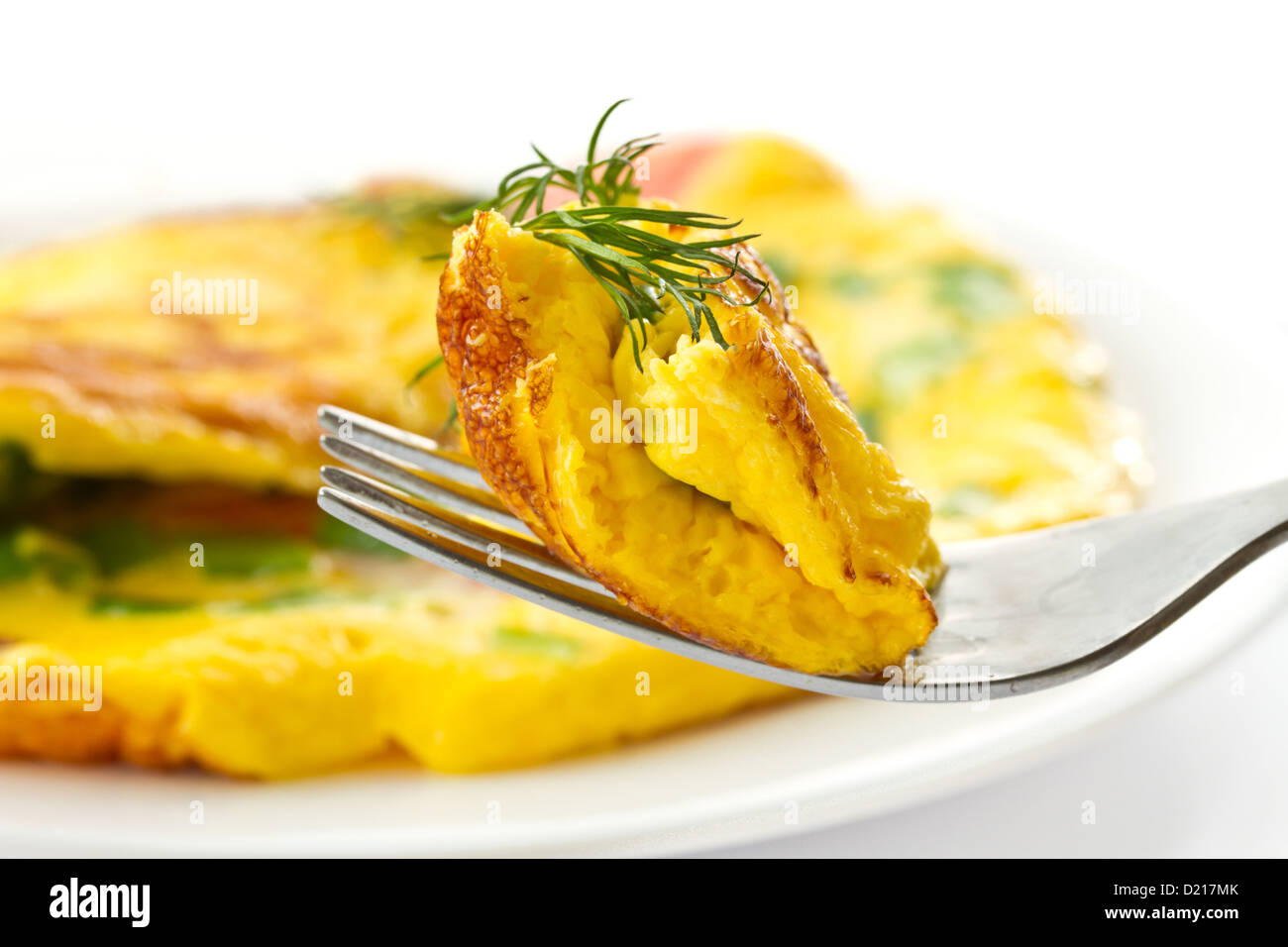 scrambled eggs with fresh herbs on a white background Stock Photo - Alamy