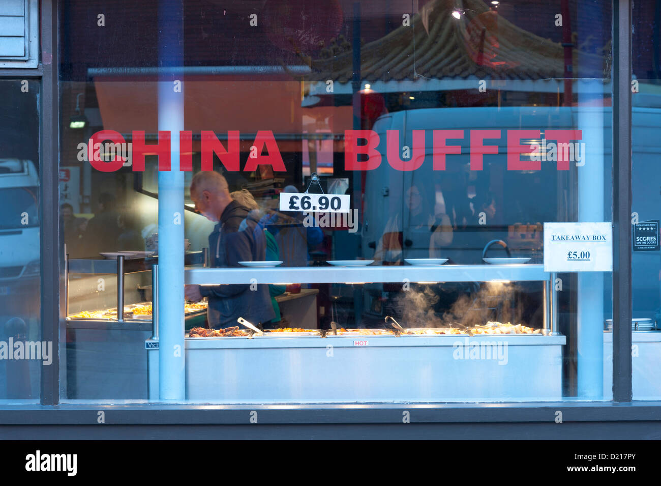 Window of a Chinese buffet restaurant at Newport Place Soho London UK with signs and prices Stock Photo