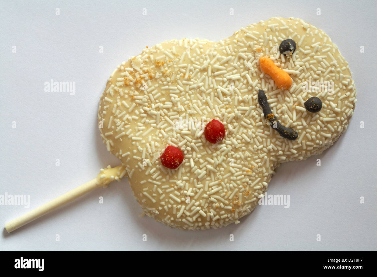 Snowman biscuit lolly on stick isolated on white background Stock Photo