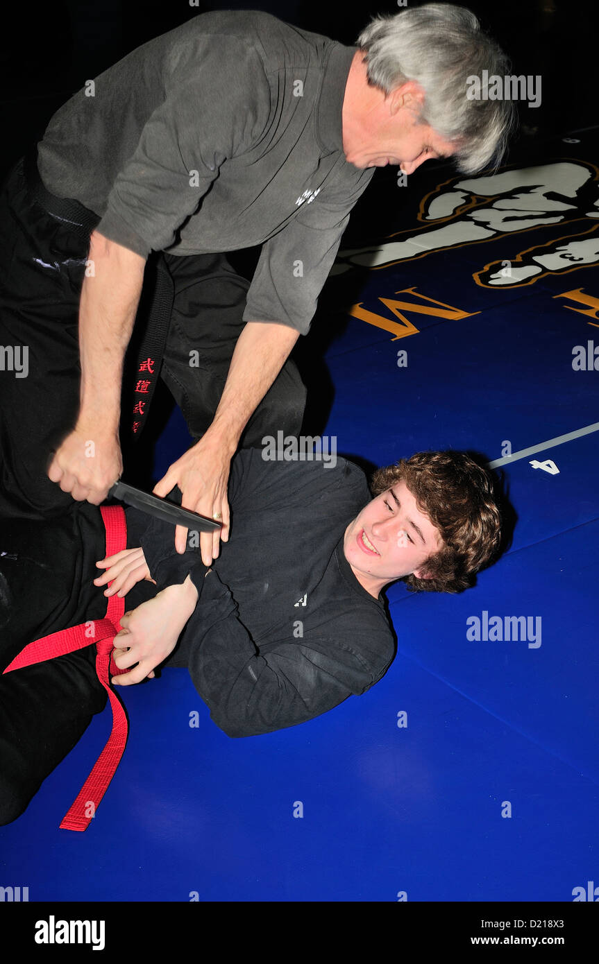Hapkido Black Belt and Red Belt combatants practicing their art at a