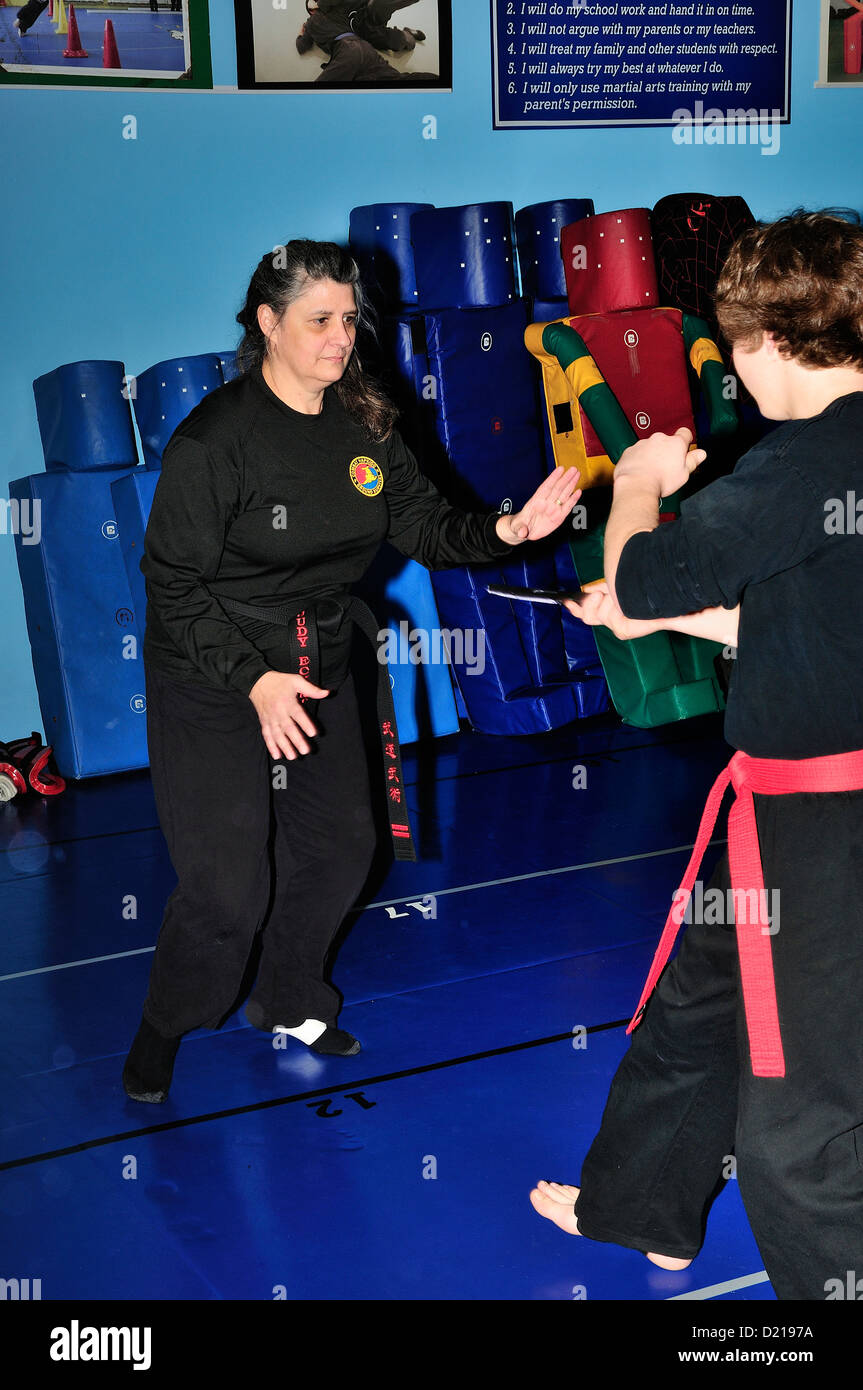 Hapkido Black Belt and Red Belt combatants practicing their art at a